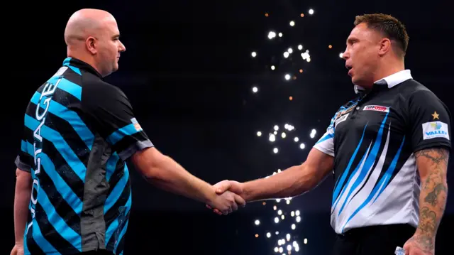 Rob Cross shakes hands with Gerwyn Price