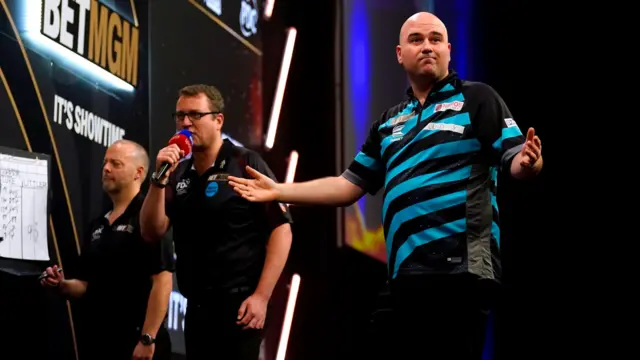 Rob Cross celebrates