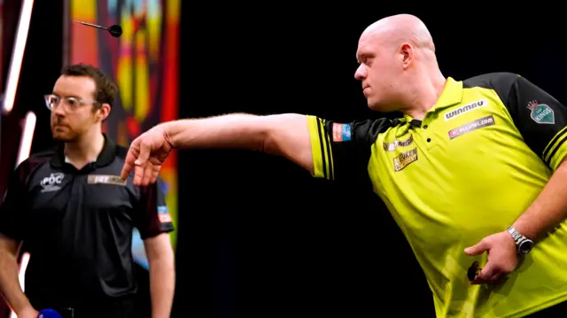 Michael van Gerwen throws a dart