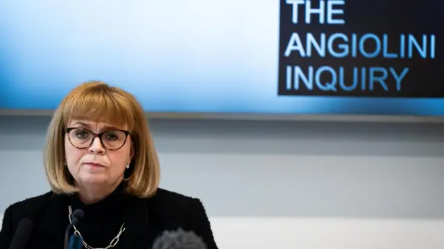 Lady Angiolini sits in front of a sign that reads The Angiolini inquiry