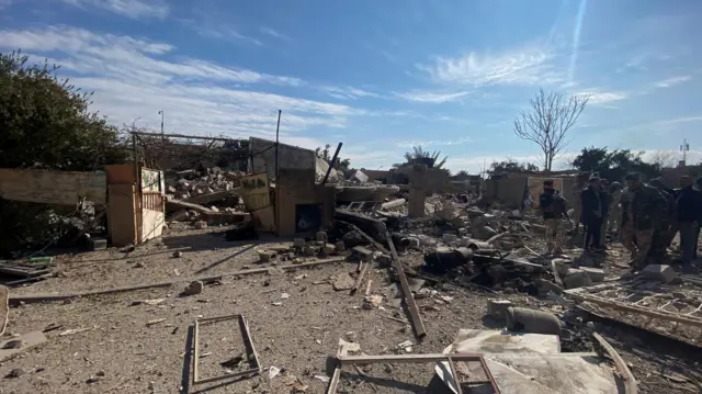 A destroyed building at the site of a US strike in the Iraqi town of al-Qaim