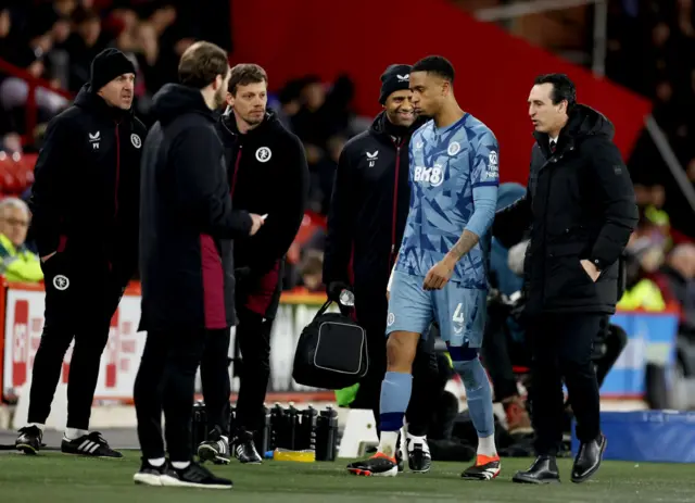 Ezri Konsa is led off the pitch