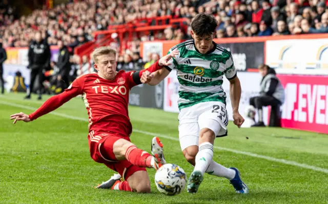 Aberdeen's Connor Barron challenges Celtic's Alexandro Bernabei