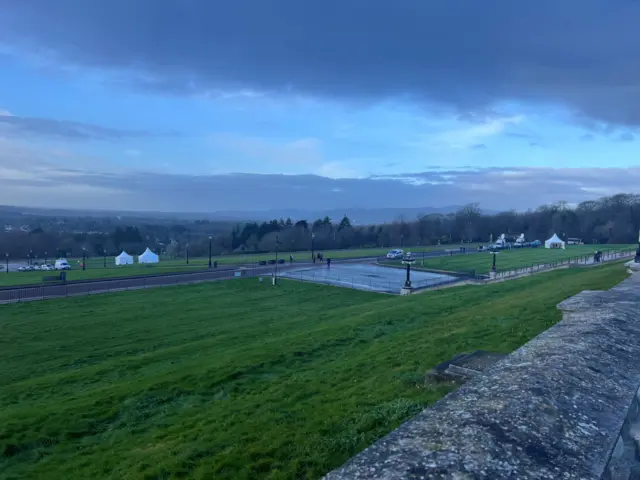 Media tents and vans pitched outside Stormont