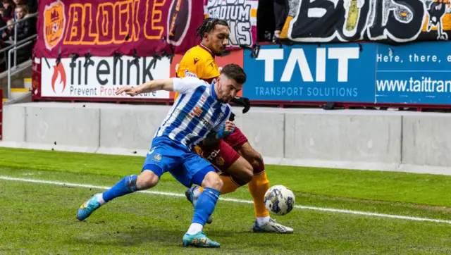 Kilmarnock's Daniel Armstrong and Motherwell's Theo Bair tussle for possession