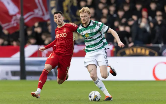 Aberdeen's Bojan Miovski chases Celtic's Liam Scales