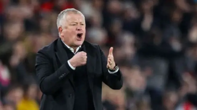 Chris Wilder punches his own hand