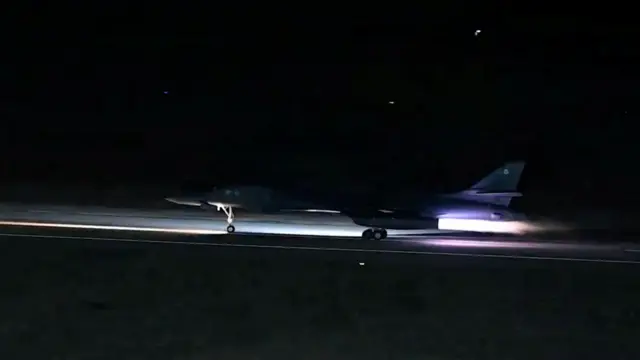 A plane takes off at night