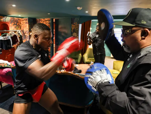 Dan Azeez on the pads backstage