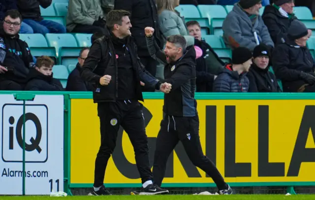 Assistant Diarmud O'Carroll and manager Stephen Robinson celebrate