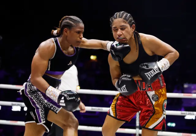 Caroline Dubois punches her opponent on the chin