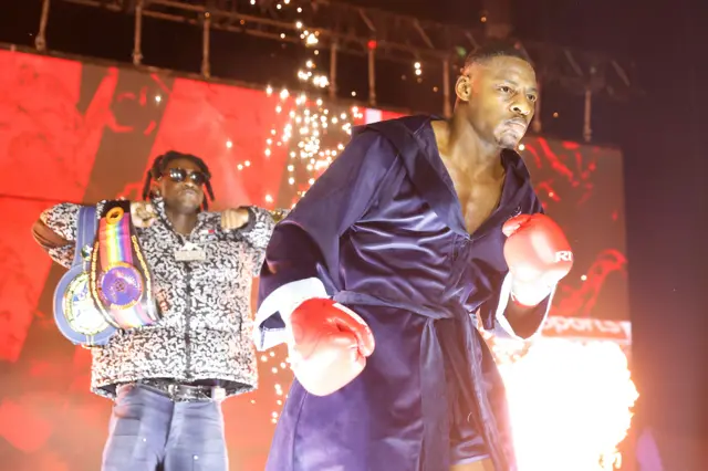 Dan Azeez makes his ringwalk in blue