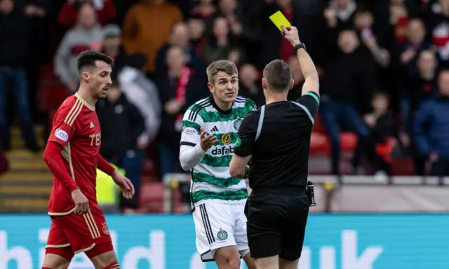 Maik Nawrocki shown yellow card