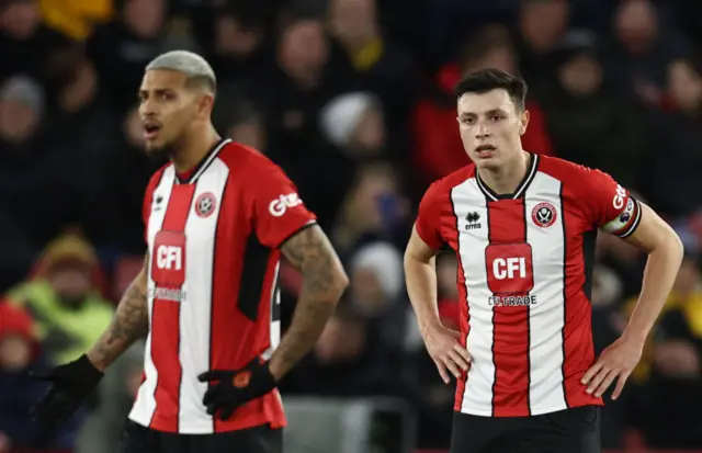 Sheffield United players Vinicius Souza and Anel Ahmedhodzic look stunned