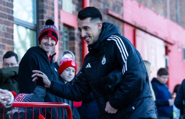 Aberdeen forward Bojan Miovski greets fans