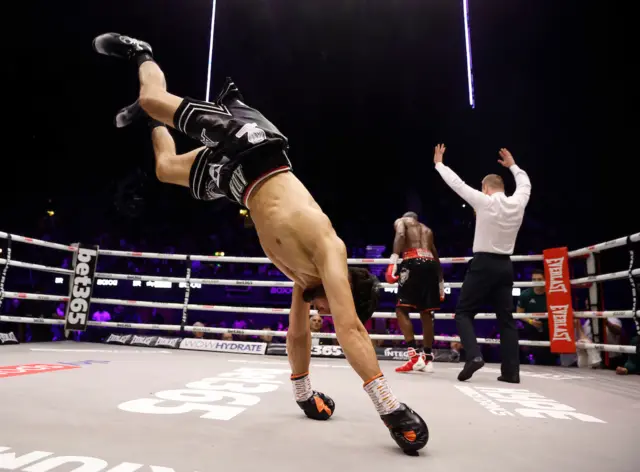 Adam Azim performs a backflip