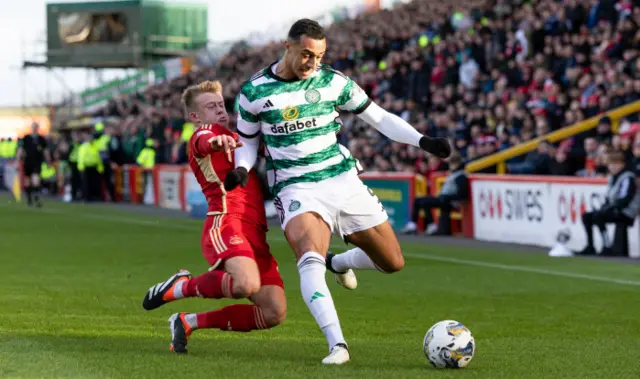 Aberdeen's Connor Barron tackles Celtic's Adam Idah