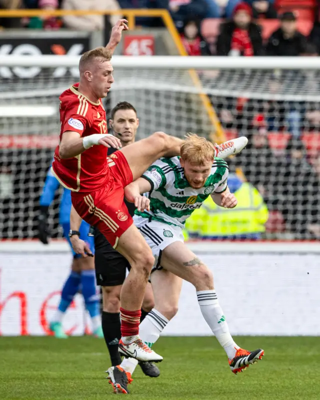 Aberdeen's Killian Phillips fouls Celtic's Liam Scales