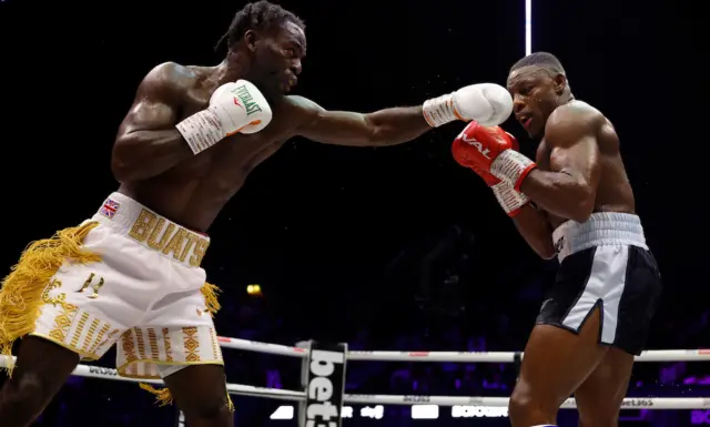 Joshua Buatsi throws a punch at Dan Azeez