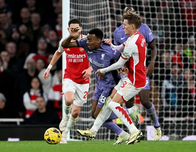 ) Ryan Gravenberch of Liverpool and Martin Odegaard of Arsenal in action