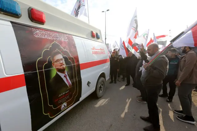 An ambulance used to carry the coffin of a member of the militia killed in US air strikes