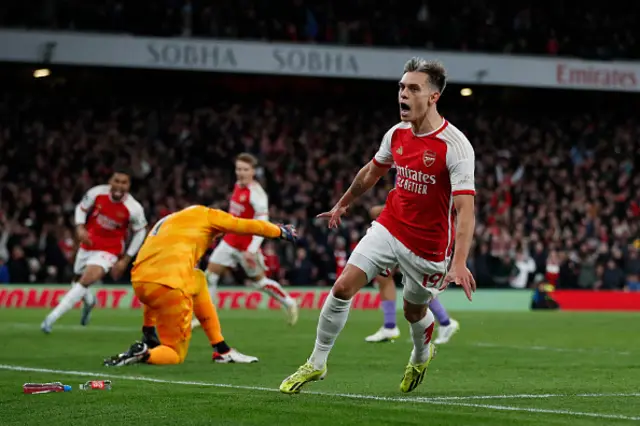 Leandro Trossard (C) celebrates after scoring