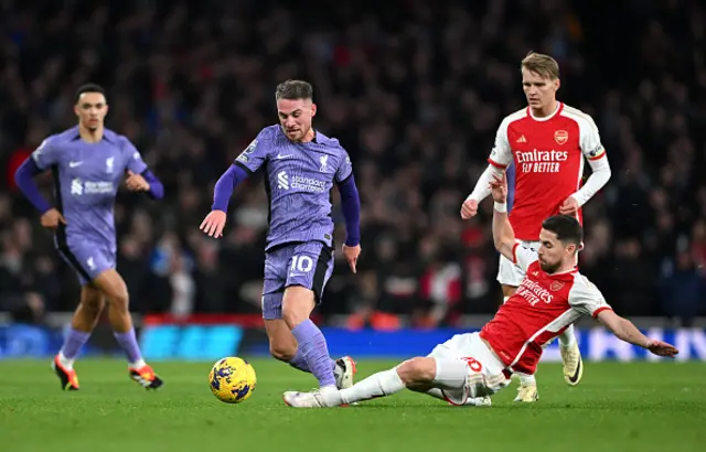 Alexis Mac Allister of Liverpool is challenged by Jorginho