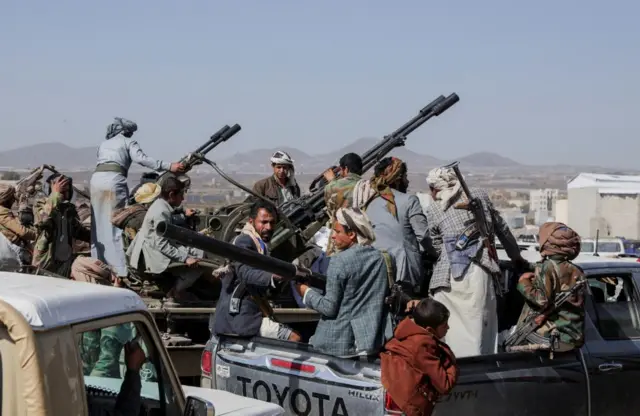 Houthi tribesmen gather to show defiance after U.S. and UK air strikes on Houthi positions near Sanaa, Yemen