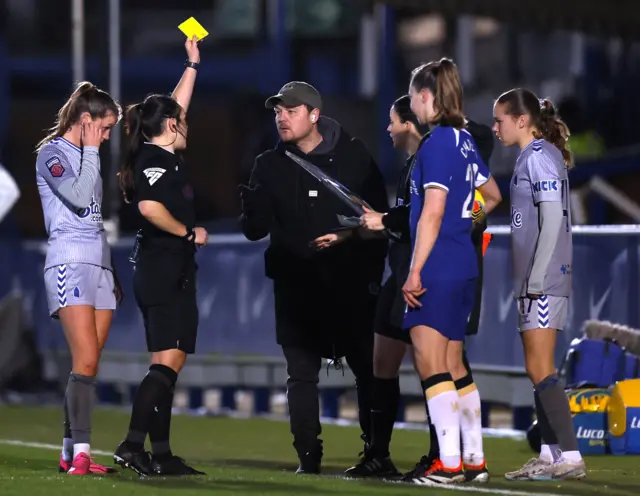 Brian Sorensen is cautioned by the referee.