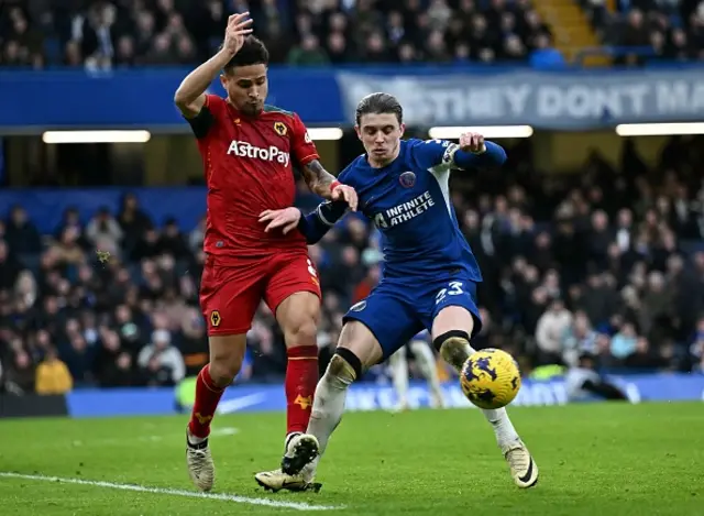 Joao Gomes (L) fights for the ball with Chelsea's English midfielder #23 Conor Gallagher