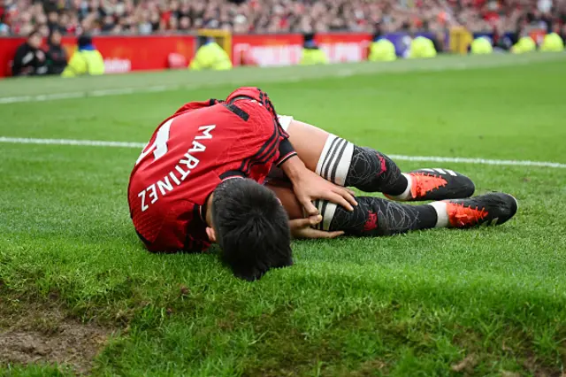 Lisandro Martinez of Manchester United goes down