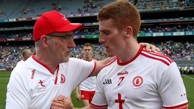 Then Tyrone boss Mickey Harte congratulates Peter Harte after a game in 2018