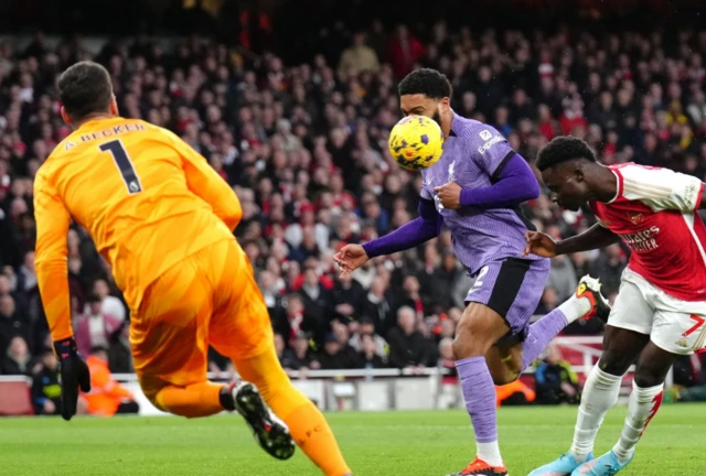 Bukayo Saka heads the ball