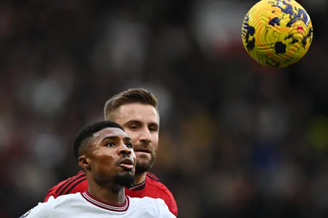 Ben Johnson and Luke Shaw eye the ball