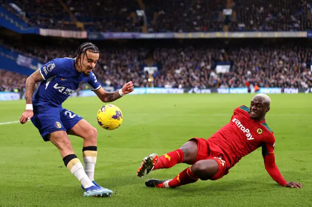 Malo Gusto of Chelsea is challenged by Toti Gomes