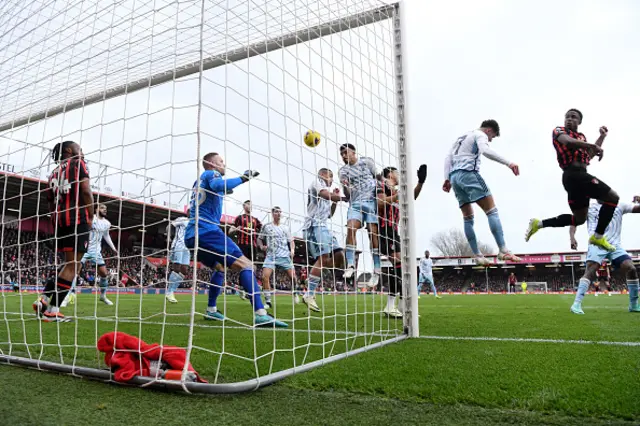 Luis Sinisterra of AFC Bournemouth wins a header whilst under pressure from Morgan Gibbs-White of Nottingham Forest, leading to AFC Bournemouth's first goal scored by teammate Justin Kluivert