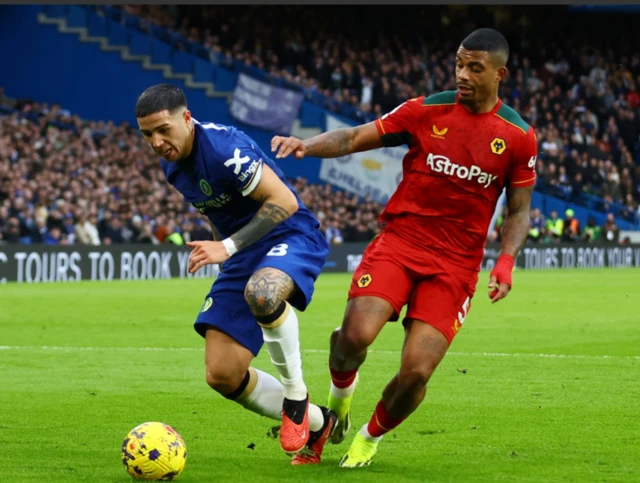 Enzo Fernandez in action with Wolverhampton Wanderers' Mario Lemina