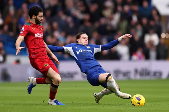 Rayan Ait-Nouri of Wolverhampton Wanderers battles for possession with Conor Gallagher