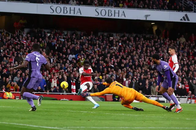 : Bukayo Saka of Arsenal scores the opening goal