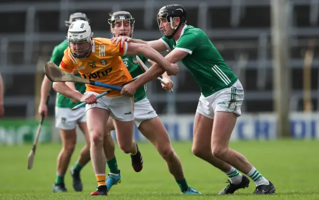 Diarmaid Byrnes tackles Rian McMullan at Semple Stadium