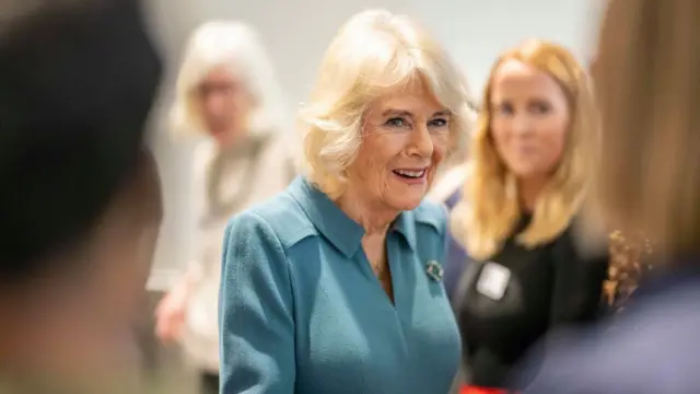 Camilla chats with a crowd of women