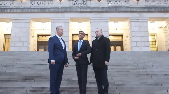 (left to right) Speaker of the Northern Ireland Assembly DUP MLA Edwin Poots, Prime Minister Rishi Sunak and Northern Ireland Secretary Chris Heaton-Harris at Parliament Buildings at Stormont, Belfast, following the restoration of the powersharing executive