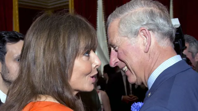 TV presenter Carol Vorderman talks to Britain's Prince Charles, Prince of Wales (R), the president of The Prince's Trust, at a reception for Prince's Trust Job Ambassadors, Young Ambassadors, and the charity's supporters to mark the appointment of one hundred Job Ambassadors, at Clarence House in central London on June 20, 2013