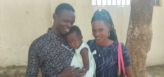 Pauline Blessing Adul with her parents.