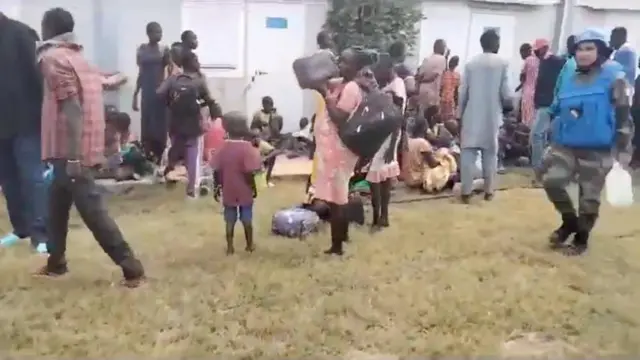 Locals gather at a UN peacekeeper camp following deadly attacks, in Dokura, Abyei region, Sudan-South Sudan border area, in this still image obtained from a social media video released January 28, 2024.