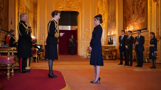 Princess Anne is pictured at Windsor Castle awarding the Queen's Gallantry Medal to Madeleine Davidson-Houston