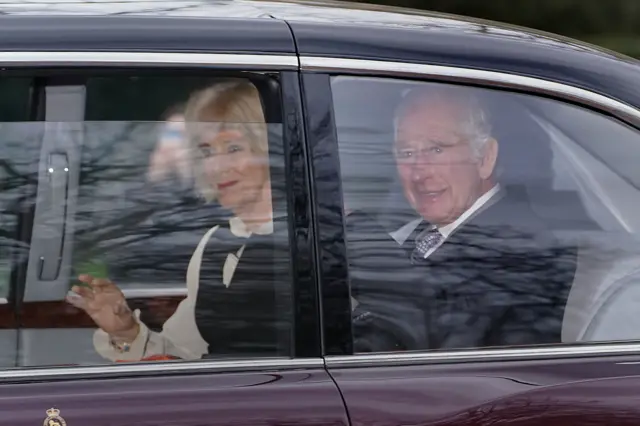 King Charles III and Queen Camilla wave as they leave Clarence House in London following the announcement of King Charles's cancer diagnosis on Monday evening