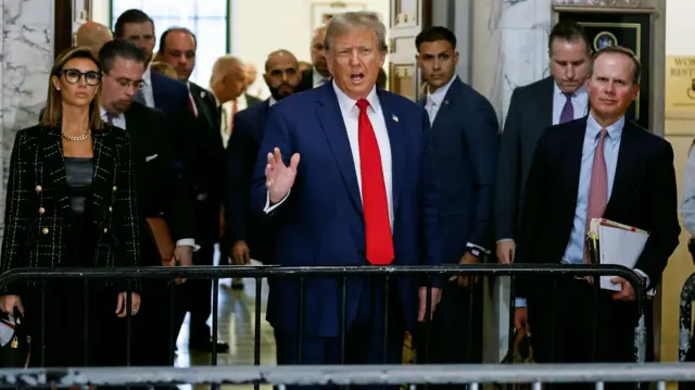 Former US President Donald J. Trump (C) speaks to the media outside the court during a lunch break on the day of the Trump Organization civil fraud trial at New York State Supreme Court in the Manhattan borough of New York, New York, USA, 11 January 2024. Trump is facing up to a 370 million US dollar fine for inflating the value of assets to get favorable loans from banks. Donald Trump to attend court for his tax fraud trial, New York, USA - 11 Jan 2024