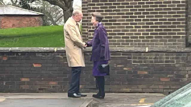 Princess Anne shakes hands with Sir John Peace, the Lord-Lieutenant of Nottinghamshire, as she arrives at a community centre in Eastwood