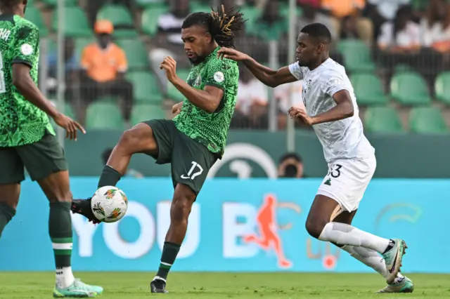 Iwobi looks to play the ball under pressure from South Africa.